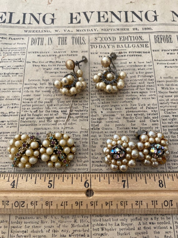 Set of three ivory-tone faux pearl earrings.