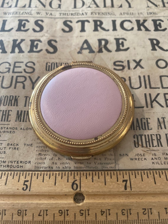 Gold-tone compact with pink leather top