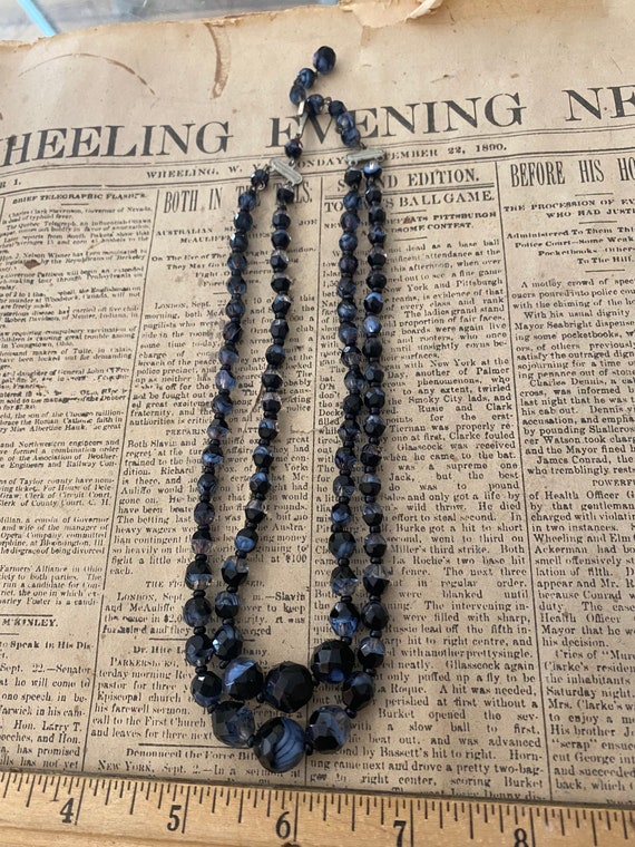 Black and blue multi strand necklace.