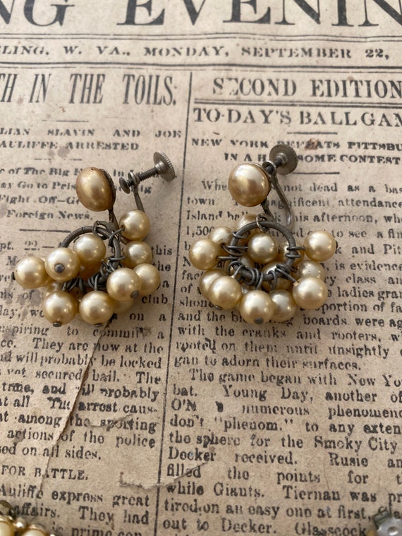 Set of three ivory-tone faux pearl earrings. - image 4