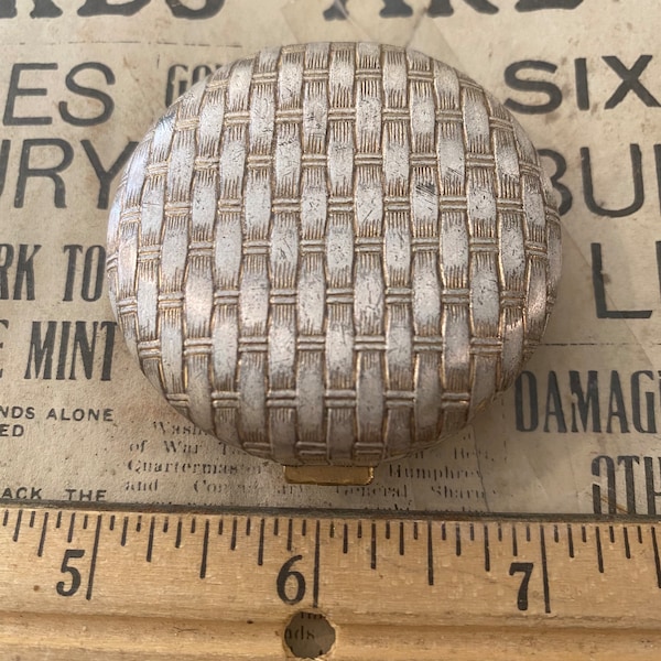 Gold-tone compact with basket weave design on lid