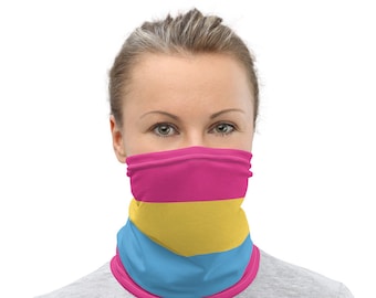 May include: A neck gaiter featuring the Pansexual Pride flag design. The gaiter displays horizontal stripes of pink, yellow, and blue. The edges are trimmed with a pink border. The person is wearing a gray shirt.