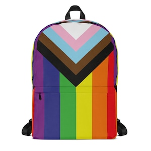 May include: A black backpack with a rainbow and a pride flag design. The rainbow is on the bottom half of the backpack and the pride flag is on the top half.