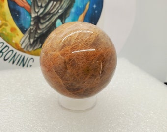 Sphère de pierre de lune pêche, grande sphère de pierre de lune pêche avec flash. Spécimen lourd de pierre de lune de pêche, décor de bureau, décor à la maison, décor de pêche,