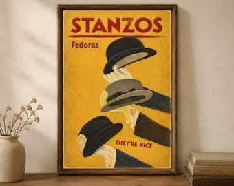May include: A rectangular framed poster with a yellow background featuring the red text STANZOS at the top and THEY'RE NICE at the bottom. The illustration depicts three hands holding dark gray fedora hats against the yellow backdrop.