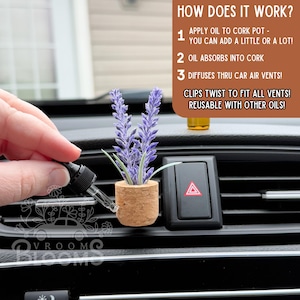 May include: A car air vent diffuser featuring a small cork pot with purple lavender. The diffuser is designed to hold essential oils and clips into car vents. The image includes text that says "HOW DOES IT WORK?" and "VROOM".