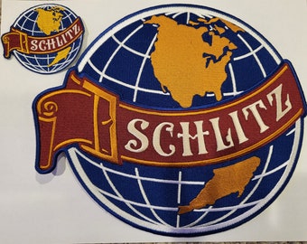 May include: A blue and white embroidered patch with a globe and a red banner that says "Schlitz".