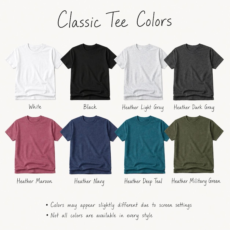 a collection of classic t-shirt colors, including white, black, light gray, dark gray, maroon, navy, deep teal, and military green. The colors may appear slightly different due to screen settings, and not all colors are available in every style.