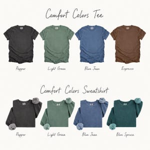 a collection of t-shirts in various colors, including black, green, blue, brown, light green, blue jeans, and blue spruces.