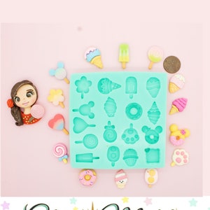 May include: A teal silicone mold with 20 different shapes of candy and ice cream. The mold is surrounded by colorful miniature replicas of the shapes in the mold.