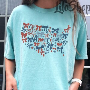 Camisa com o mapa dos EUA, camisa com o laço do mapa dos EUA, camisa com a American Girl, camisa do 4 de julho, camisa com o mapa dos EUA com laço, camisa com a bandeira americana