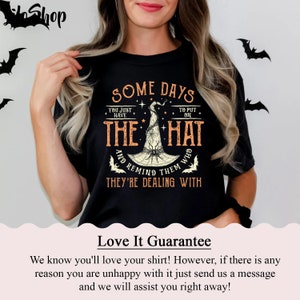 May include: Black t-shirt with a graphic of a witch's hat and the text "Some days you just have to put on the hat and remind them who they're dealing with".