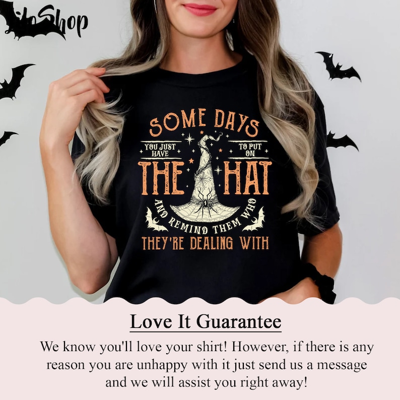 May include: Black t-shirt with a graphic of a witch's hat and the text "Some days you just have to put on the hat and remind them who they're dealing with".