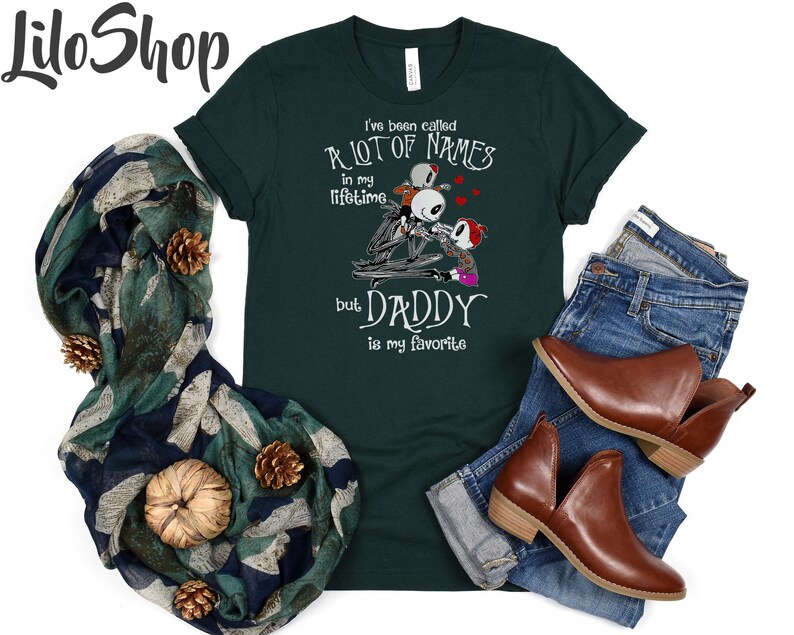 May include: Green t-shirt with a graphic of three skeleton figures and the text "I've been called a lot of names in my lifetime but Daddy is my favorite".