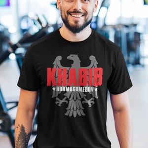 Khabib The Eagle Nurmagomedov GOAT Fighter usa camiseta unisex gráfica Black