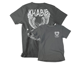 May include: Two gray t-shirts with a white eagle graphic and the text "Khabib Nurmagomedov" on the back of one shirt and the front of the other.