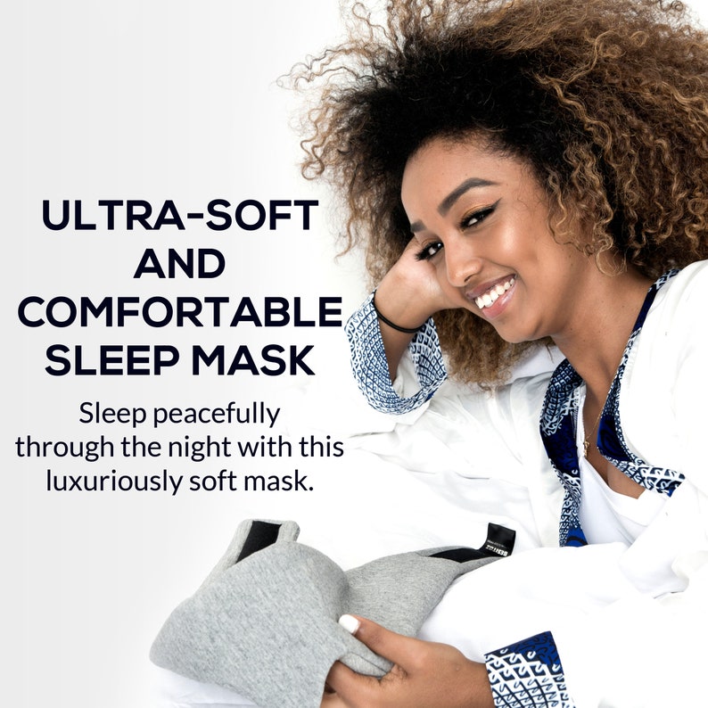May include: A gray sleep mask with a black elastic band. The mask is made of soft, comfortable material. The text on the image reads: "ULTRA-SOFT AND COMFORTABLE SLEEP MASK. Sleep peacefully through the night with this luxuriously soft mask."