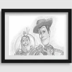 May include: A framed pencil sketch depicting Buzz Lightyear and Woody from Toy Story. Buzz is in his space suit, giving a peace sign. Woody wears a cowboy hat and sheriff's badge. The artwork is in a black frame.