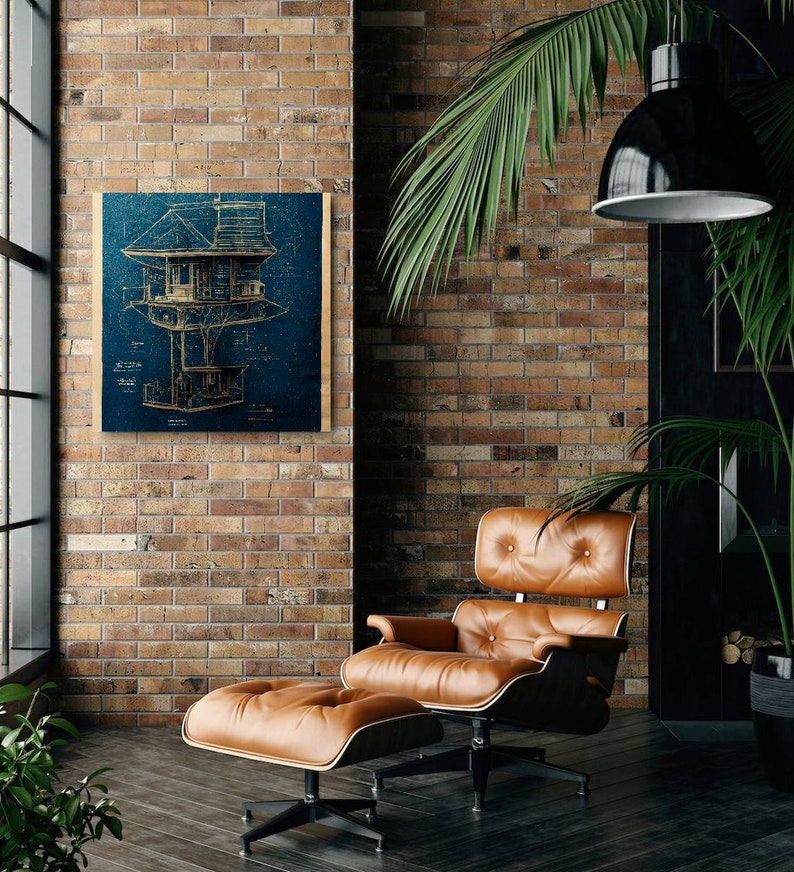 May include: A blueprint style illustration of a treehouse printed on a wood panel with a dark blue background. The illustration is framed and hanging on a brick wall. A brown leather armchair and ottoman are in the foreground.