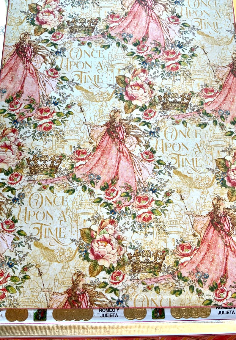 May include: Decorative paper with a fairytale theme. The design features illustrations of a princess in a pink gown, roses, crowns, and castles. The words "Once Upon a Time" are also visible.