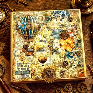 May include: A square, steampunk-themed box with a hot air balloon design. The box features gears, flowers, and a map-like background in shades of gold, teal, and brown. The text on the box reads: "The world of reality has its limits, the world of imagination is boundless."