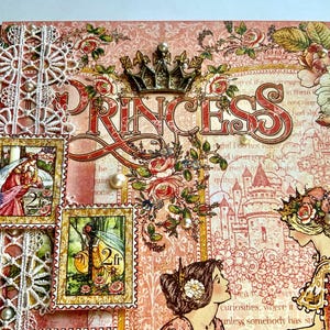 May include: A decorative scrapbook cover with a princess theme. The cover features the word "PRINCESS" in large letters, a crown, floral accents, and two postage stamp-style images. The color palette includes pink, red, and gold.