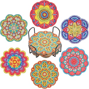 May include: Set of six colorful round coasters with intricate mandala designs. Each coaster features a different color combination of red, yellow, blue, and green.