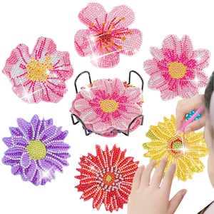 May include: Six colorful flower-shaped coasters with a diamond-like sparkle. The coasters are made of resin and feature a variety of flower designs, including pink, purple, yellow, and red.