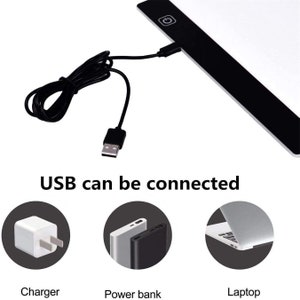 May include: A black USB-powered light pad with a power button. The light pad can be connected to a charger, power bank, or laptop. "USB can be connected" is written below the light pad.