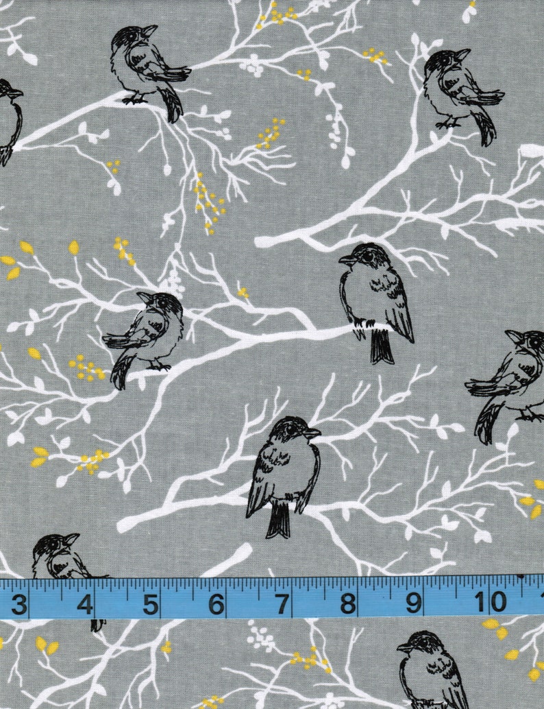 May include: Gray fabric with a white branch pattern and black birds. The fabric has a subtle yellow fleck throughout.