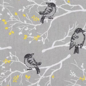 May include: A gray fabric with a white branch pattern and black birds. The birds are perched on the branches and have a simple design.