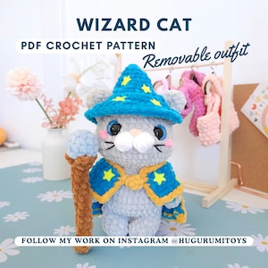 May include: A grey crochet cat wearing a blue wizard hat and cape with yellow stars. The cat holds a brown and blue staff. Text on the image reads "WIZARD CAT PDF CROCHET PATTERN Removable outfit". The cat is on a floral patterned surface.