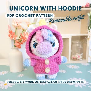 May include: A crocheted unicorn with a pink hoodie and removable outfit. The unicorn has a white body, blue eyes, and a multi-colored mane. The hoodie has two wooden buttons. Text on the image says "Unicorn with Hoodie" and "PDF Crochet Pattern".