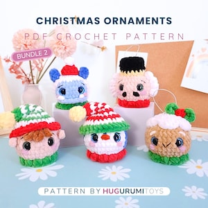 May include: Five handmade crochet Christmas ornaments, each with a unique character design. The ornaments include a penguin, elf, and bear, all wearing festive hats. The ornaments are in red, green, blue, and white. The image text reads "Christmas Ornaments PDF Crochet Pattern".