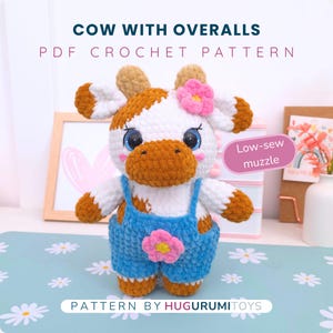 May include: A crocheted cow toy in white, brown, and blue. The cow is wearing blue overalls with a pink flower and has a pink flower on its head. The image text says "COW WITH OVERALLS PDF CROCHET PATTERN" and "PATTERN BY HUGURUMITOYS."