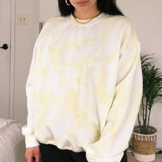 pastel yellow sweatshirt
