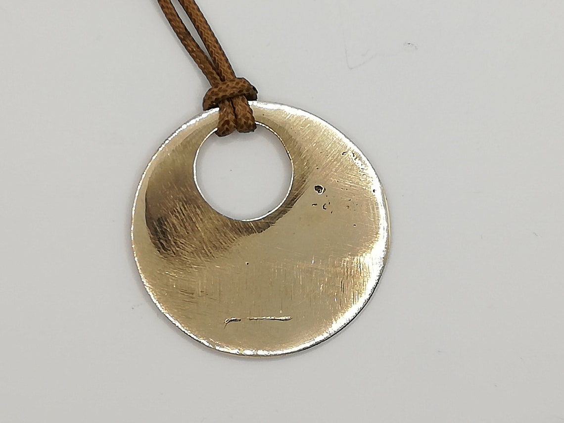 Bronze disk pendant. | Etsy