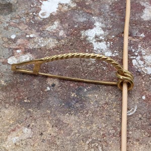 BRASS-Nauheim Celtic bow fibula. 3.18&quot;