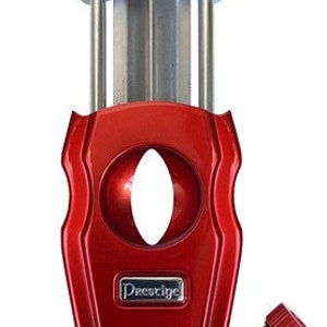 May include: A red and silver cigar cutter with a guillotine blade and a Prestige logo. The cutter has a built-in punch for smaller cigars.