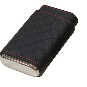 May include: Black leather cigar case with red stitching and a silver metal interior. The case has a quilted pattern.