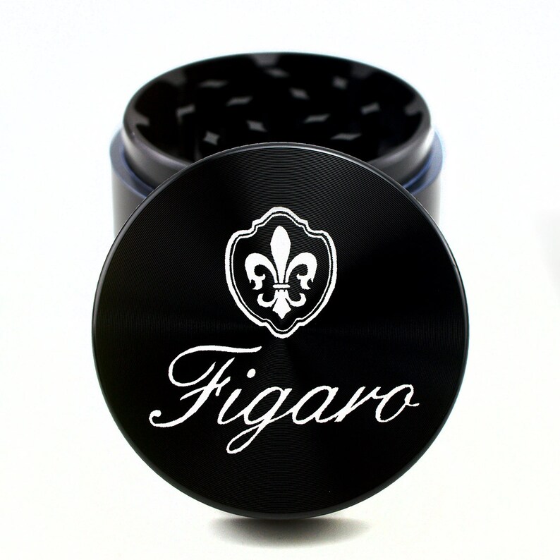 May include: Black metal grinder with a fleur-de-lis design and the word "Figaro" engraved on the lid.