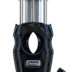 May include: A black and silver cigar cutter with a Prestige logo. The cutter has a guillotine blade and a removable cap.