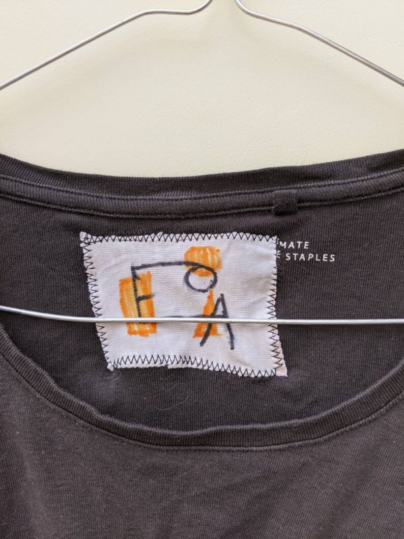 Up-cycled t-shirt machine and hand embroidered