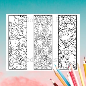 May include: Three black and white printable bookmarks featuring a cat-themed doodle design. The bookmarks are rectangular and have a whimsical, intricate pattern of cats, flowers, and other decorative elements.