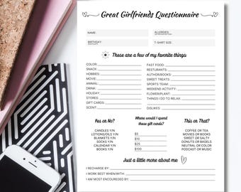 May include: A white "Great Girlfriends Questionnaire" sheet with fill-in-the-blank sections for personal preferences. Includes sections for favorite things, gift card spending, and recharge activities. A phone and notebooks are in the background.
