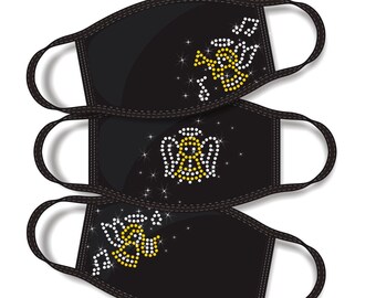 May include: Three black face masks with gold and white rhinestone designs. The designs include a trumpet, an angel, and a flower. The masks are stacked on top of each other.  "RHINESTONE TEMPLATE INSTANT DOWNLOAD www.amazingrhinestone.com" is written at the top of the image.