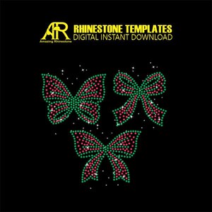 May include: Rhinestone template design featuring two butterflies and two bows. The butterflies are green and pink, and the bows are pink and green.
