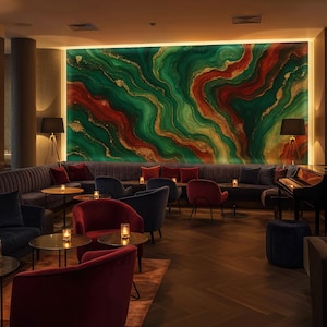 May include: A luxurious lounge area with a large, abstract wall mural in shades of green, red, and gold. The room features velvet seating in various colors, including red, blue, and gray, with small tables and candles. A grand piano and floor lamps add to the ambiance.