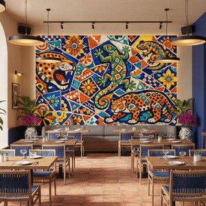 May include: A restaurant interior featuring a vibrant mural with jaguar and lizard designs in blue, orange, and yellow. Wooden tables and blue chairs are arranged in rows. The space is illuminated by pendant lights and has a bar area.