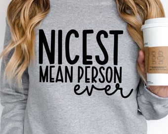 May include: Gray sweatshirt with the text "NICEST MEAN PERSON ever" in black.